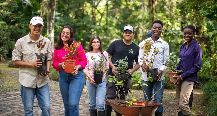 community development-700x375 Young students with plants